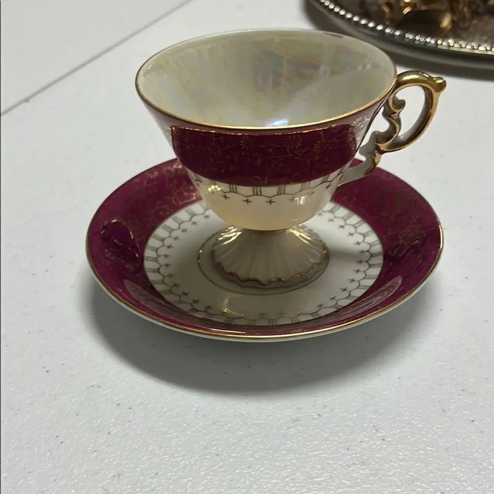 Elegant Gold and Burgundy Teacup and Saucer